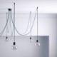Soporte con enganche de techo negro para cable eléctrico textil con tornillo de fijación.